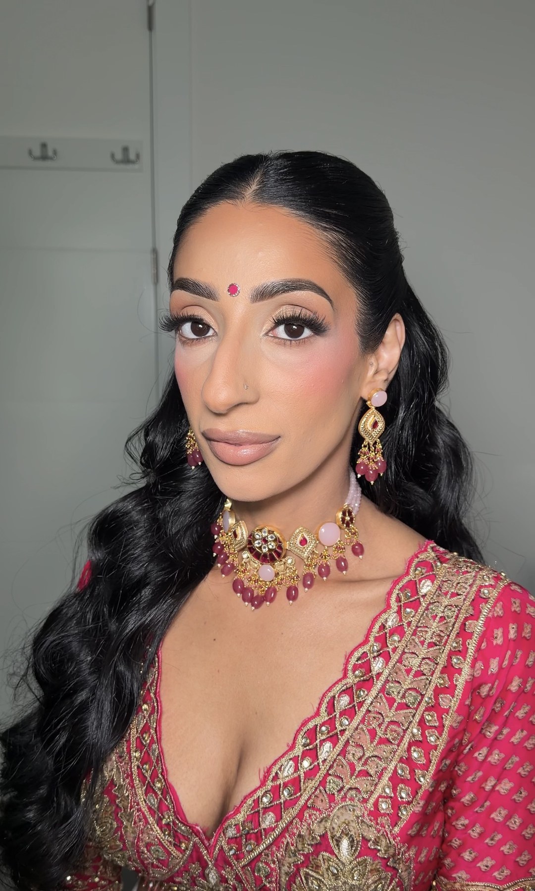 Bridal look — pink and gold with bindi