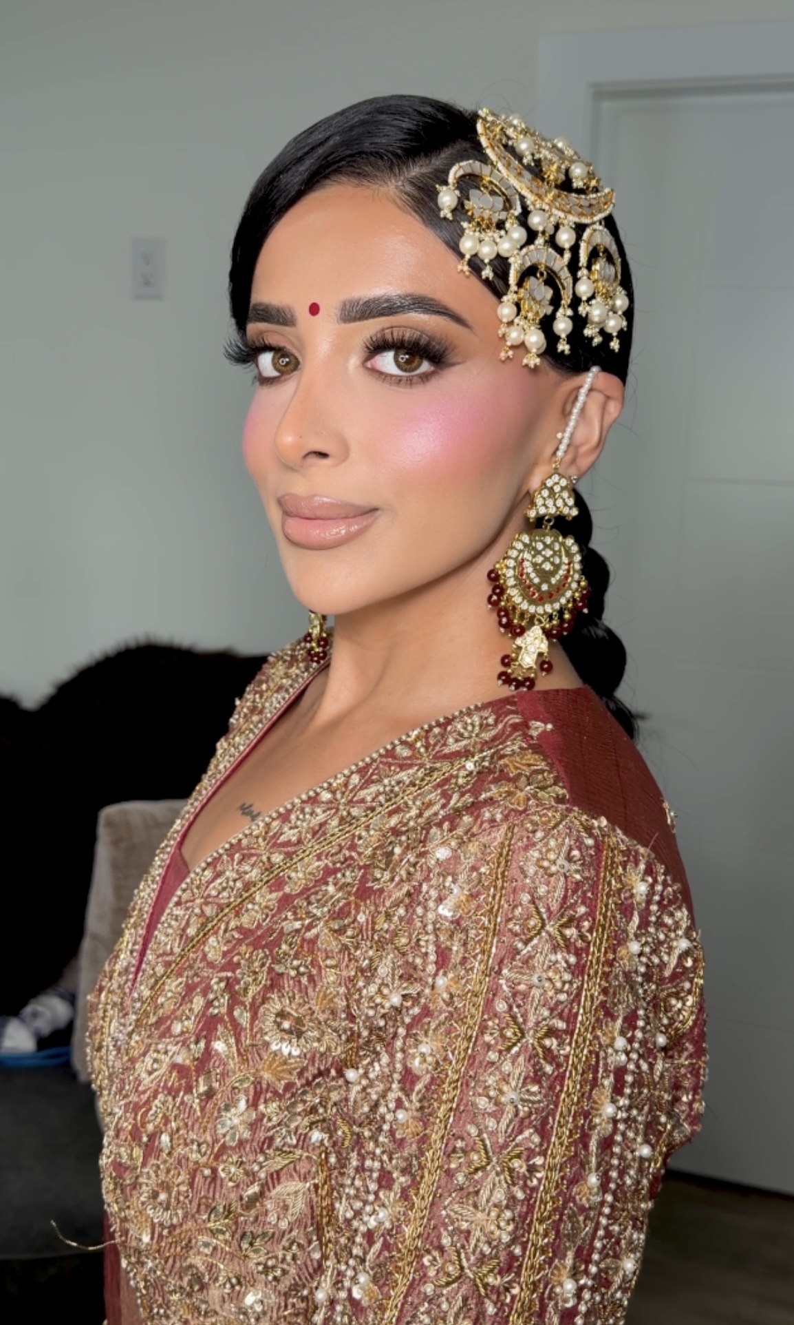 Bridal look — maroon and gold outfit with matha patti